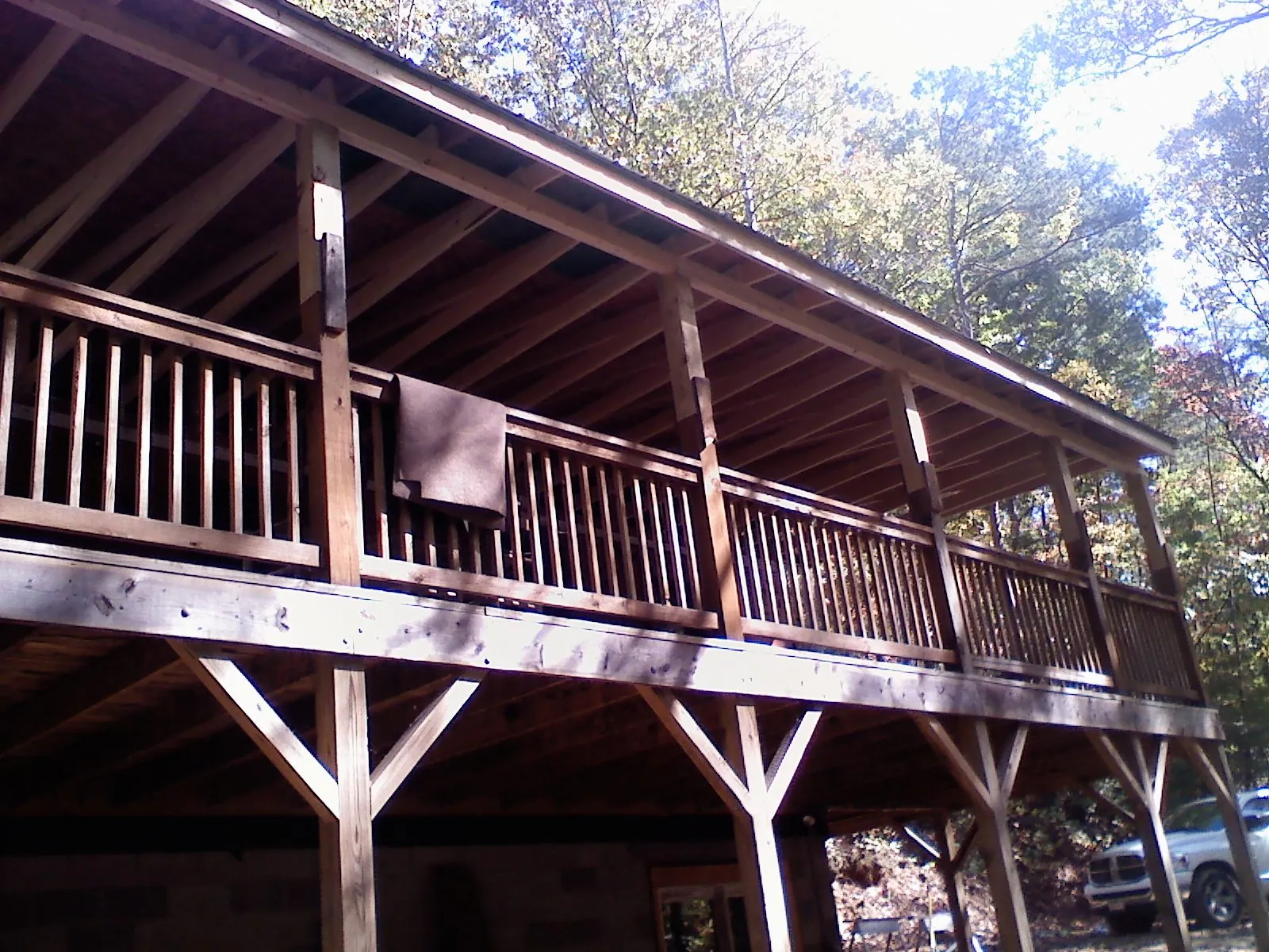 Timber framing under a new elevated porch and deck — Roof Leak Repair in Gaines by Roofing Brothers